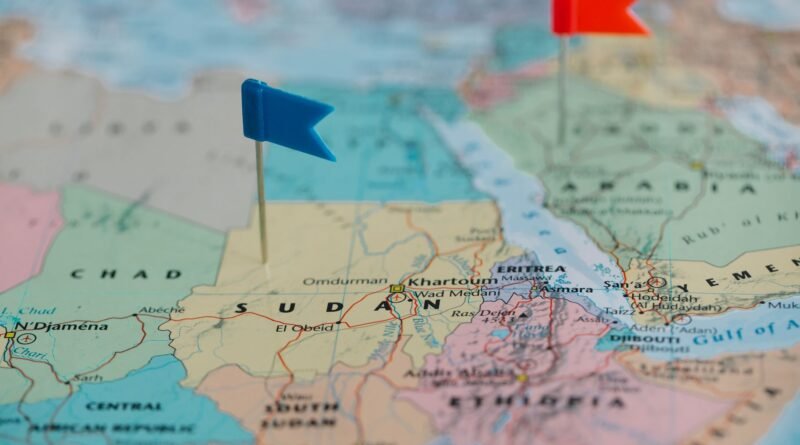 blue and red tiny flags on map